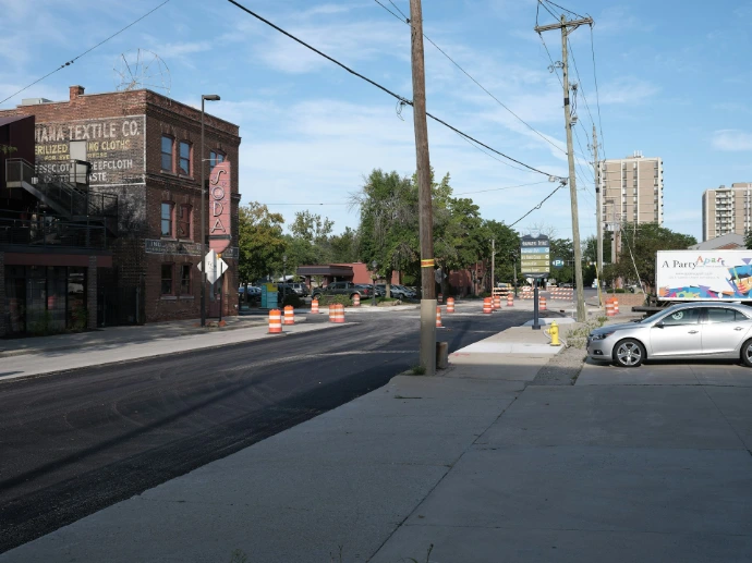 Street with construction cones and buildings